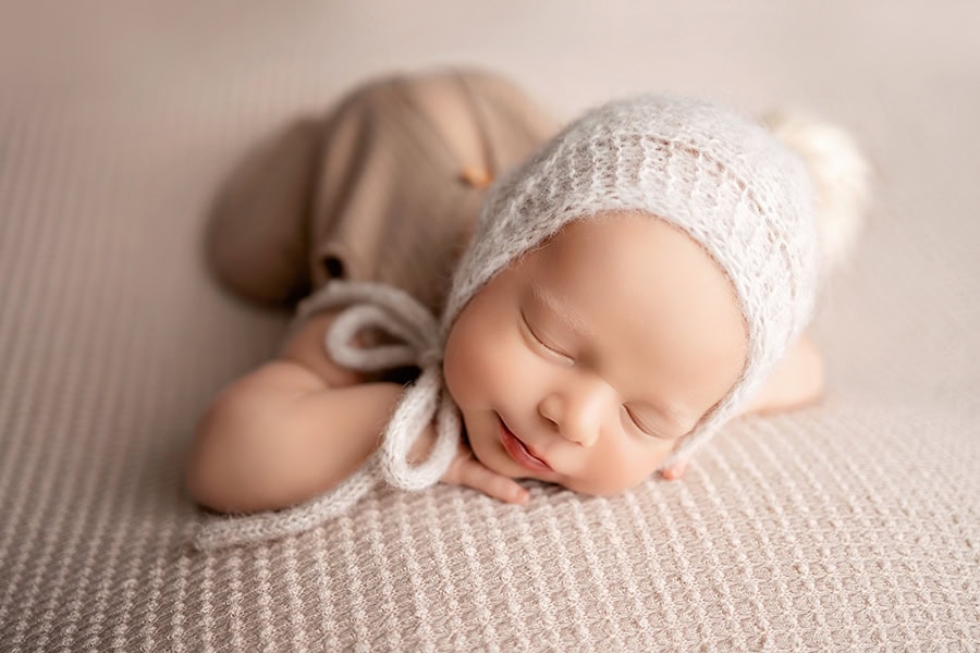 Newborn posed on belly